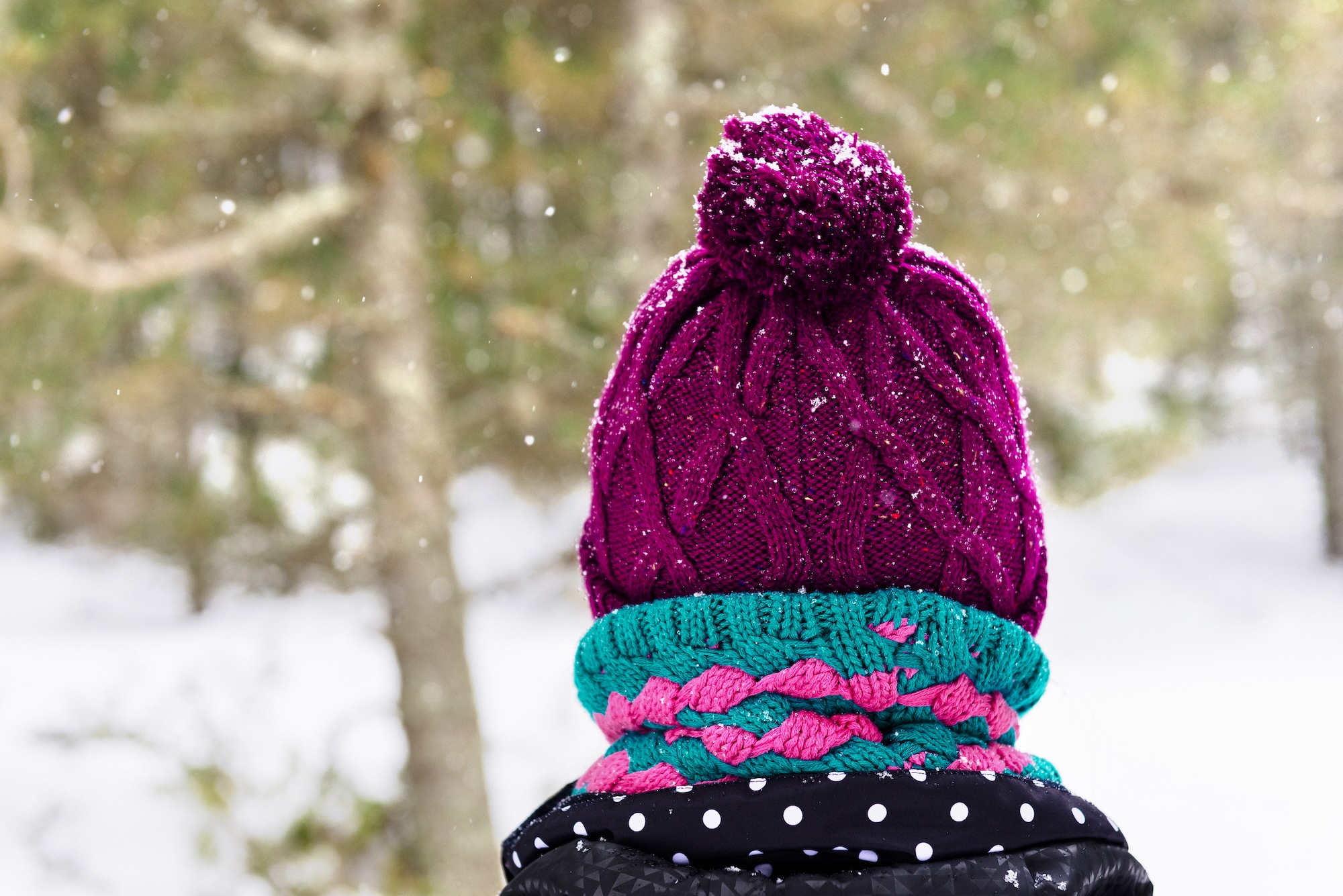 Winter hat and scarf worn with hearing aids